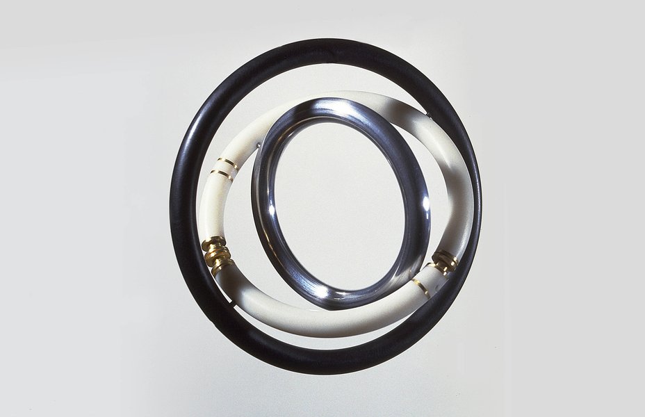 ‘Gyro’ Bracelet, 1976, by David Watkins. 18ct gold, aluminium and Perspex. 

