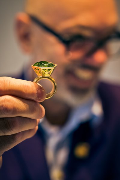 Jeweller Mark Nuell with one of his rings. Mark grew up on a gem mine in Australia and now cuts and mounts his own gemstones in his unique style. Photograph by Paul Read.