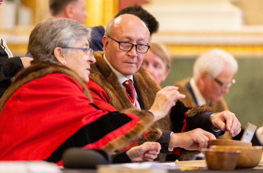 Wardens Dame Lynne Brindley and Richard Fox examine a commemorative coin at the Trial of the Pyx 2019